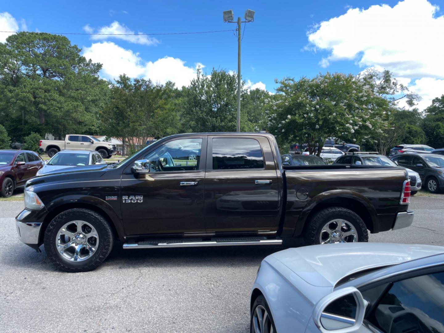 2013 BROWN RAM 1500 LARAMIE (1C6RR6NT8DS) with an 5.7L engine, Automatic transmission, located at 5103 Dorchester Rd., Charleston, SC, 29418-5607, (843) 767-1122, 36.245171, -115.228050 - Clean CarFax (no accidents reported!) Leather, Navigation, Backup Camera, CD/Sat/Bluetooth, Dual Climate Control, Power Everything (windows, locks, seats, mirrors), Heated/Cooled Seats, Heated Rear Seats, Heated Steering Wheel, Power Sliding Rear Window, Power Inverter, Push Button Start, Keyless E - Photo#3